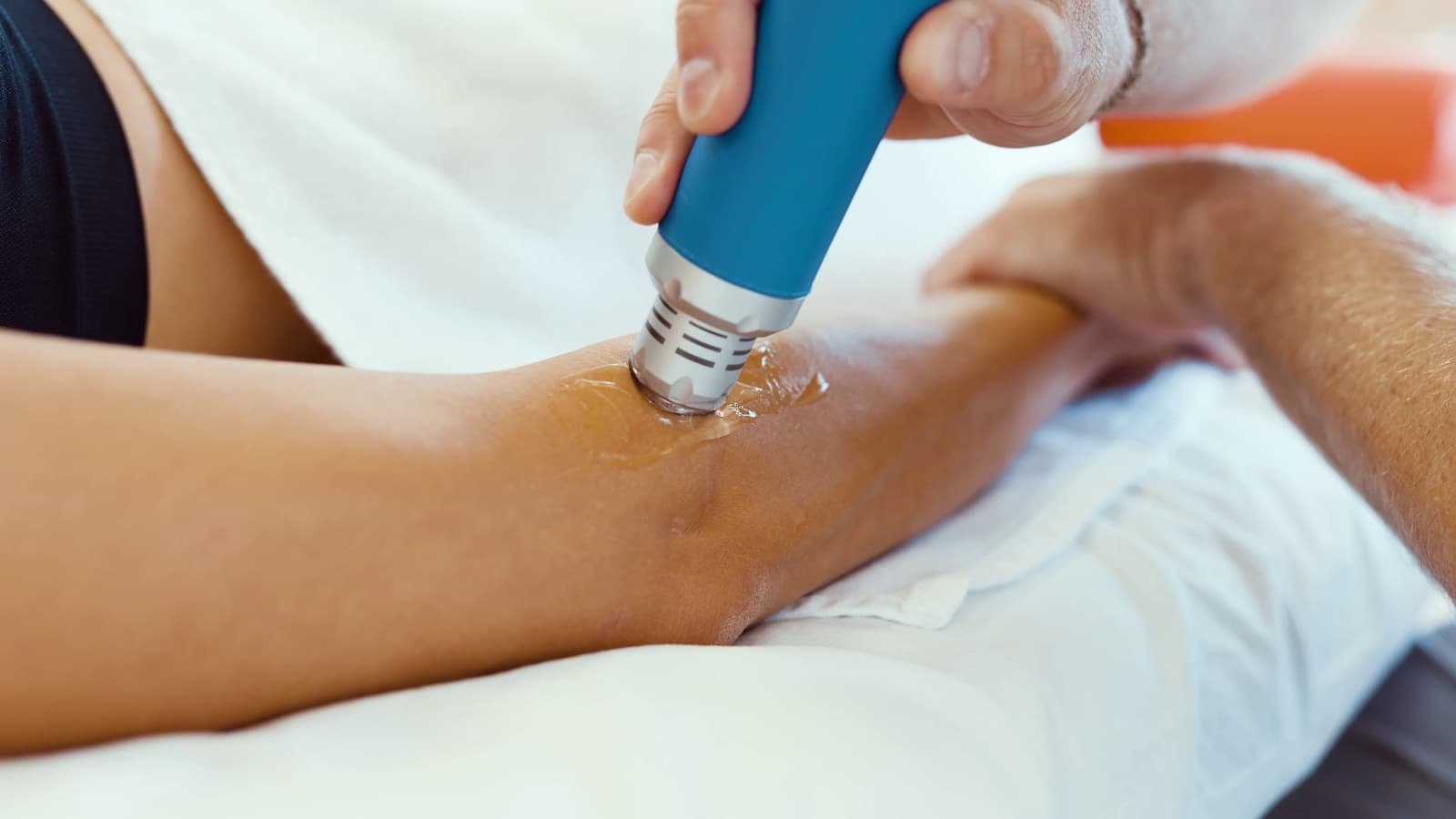 Shockwave therapy being applied to the forearm below the elbow